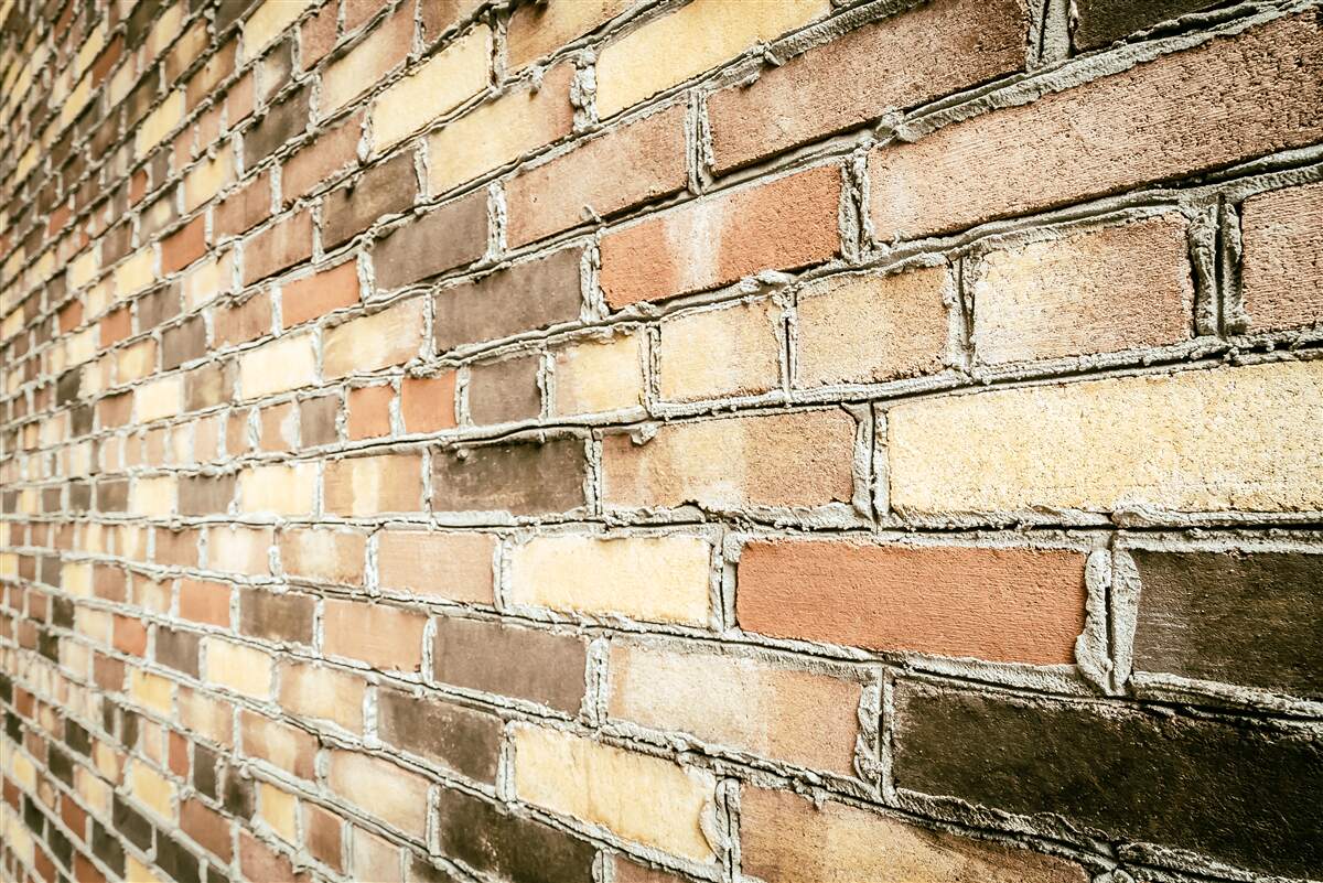 Fototapeta bočný pohľad na tehlovú stenu
