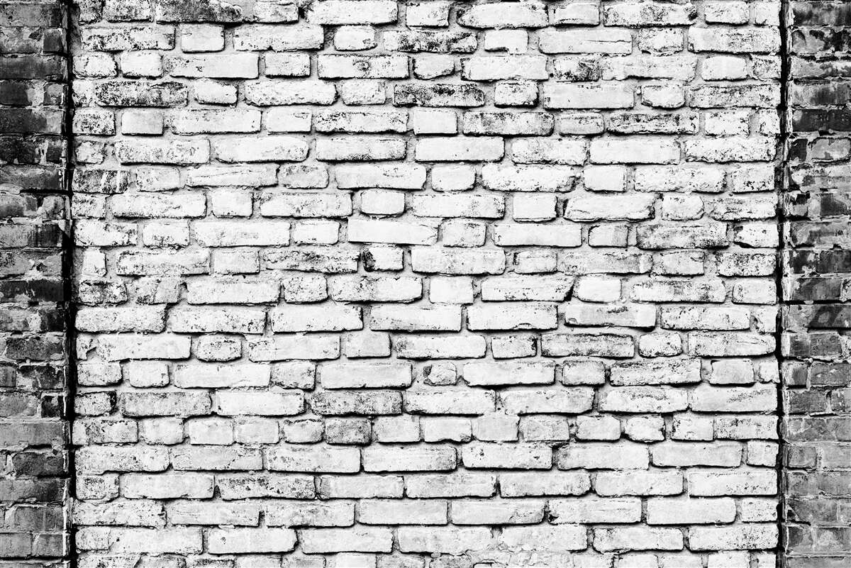 Fototapeta Tehlová stena so stopami škrabancov