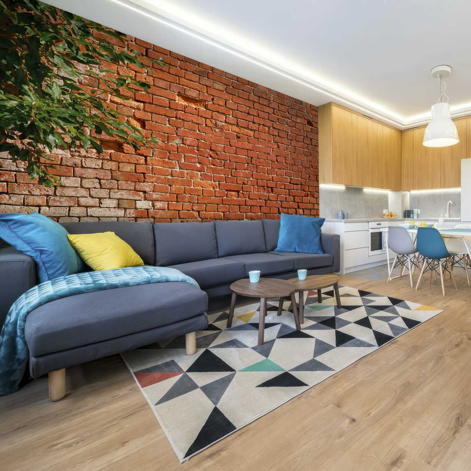 Fototapeta drevená vetva vedľa tehlovej bariéry