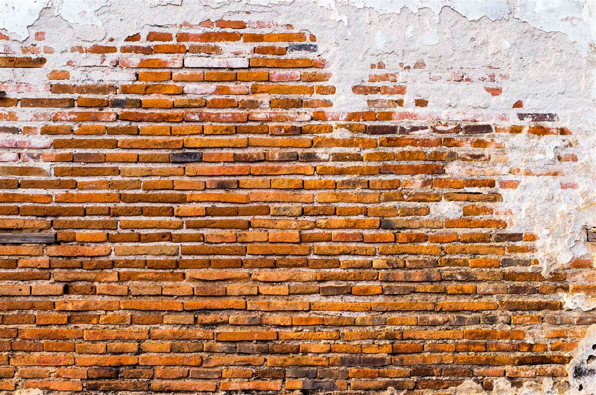 Fototapeta stará tehlová stena, ktorá stratila svoj vzhľad