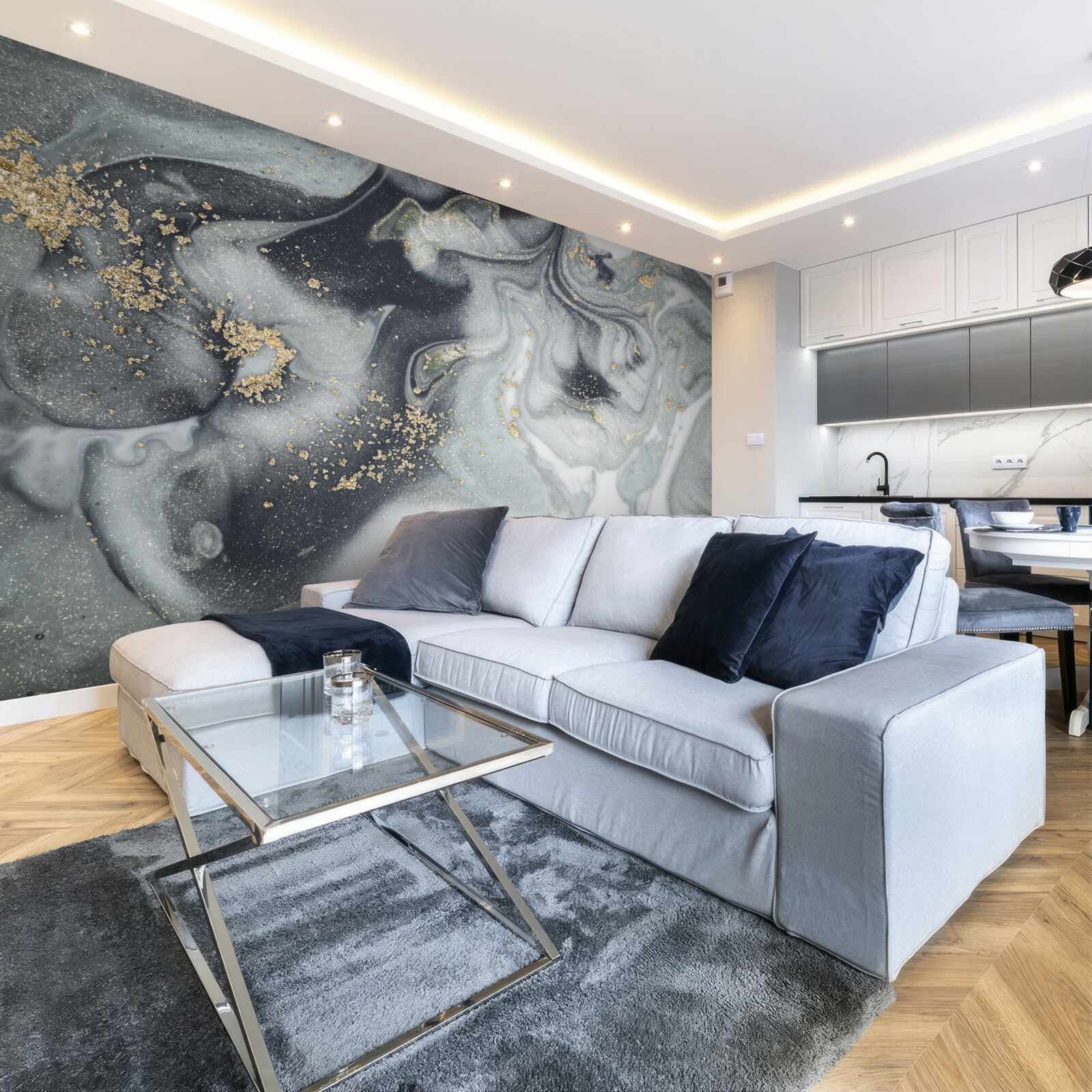 Fototapeta zlaté zrnká piesku na sivom mramorovom povrchu