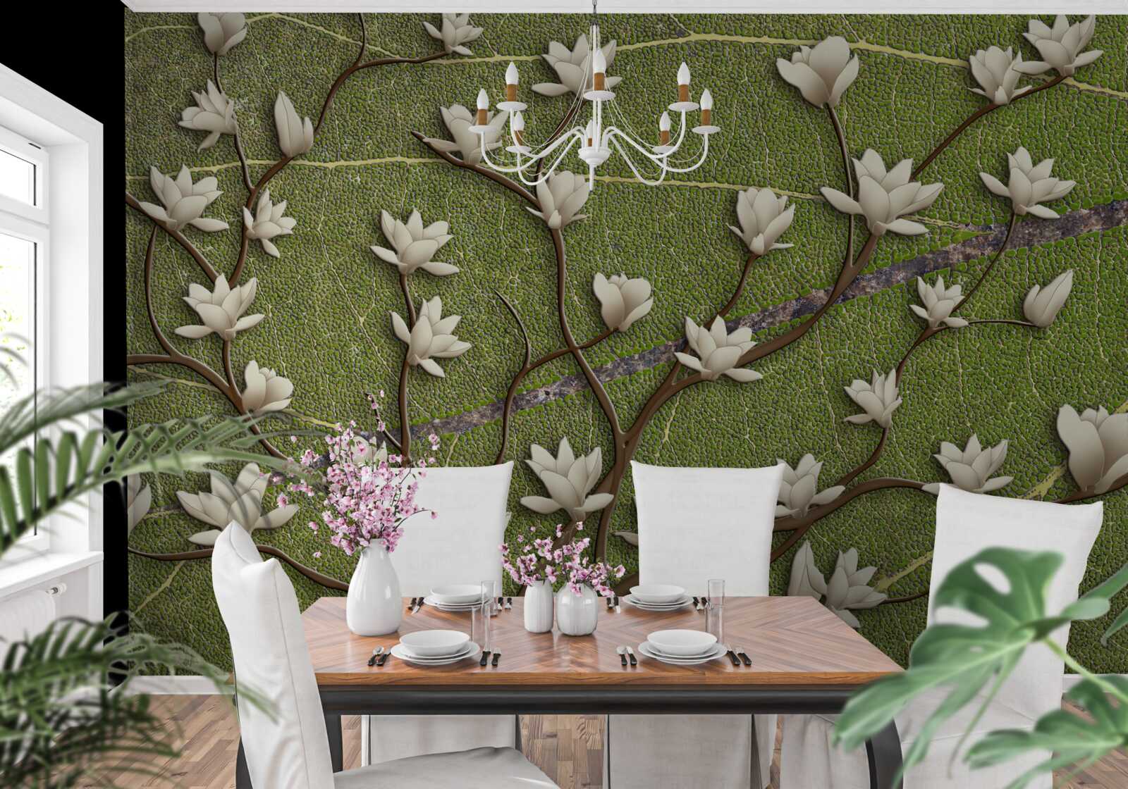 Fototapeta Snehobiele konáre magnólie na zelenom pozadí