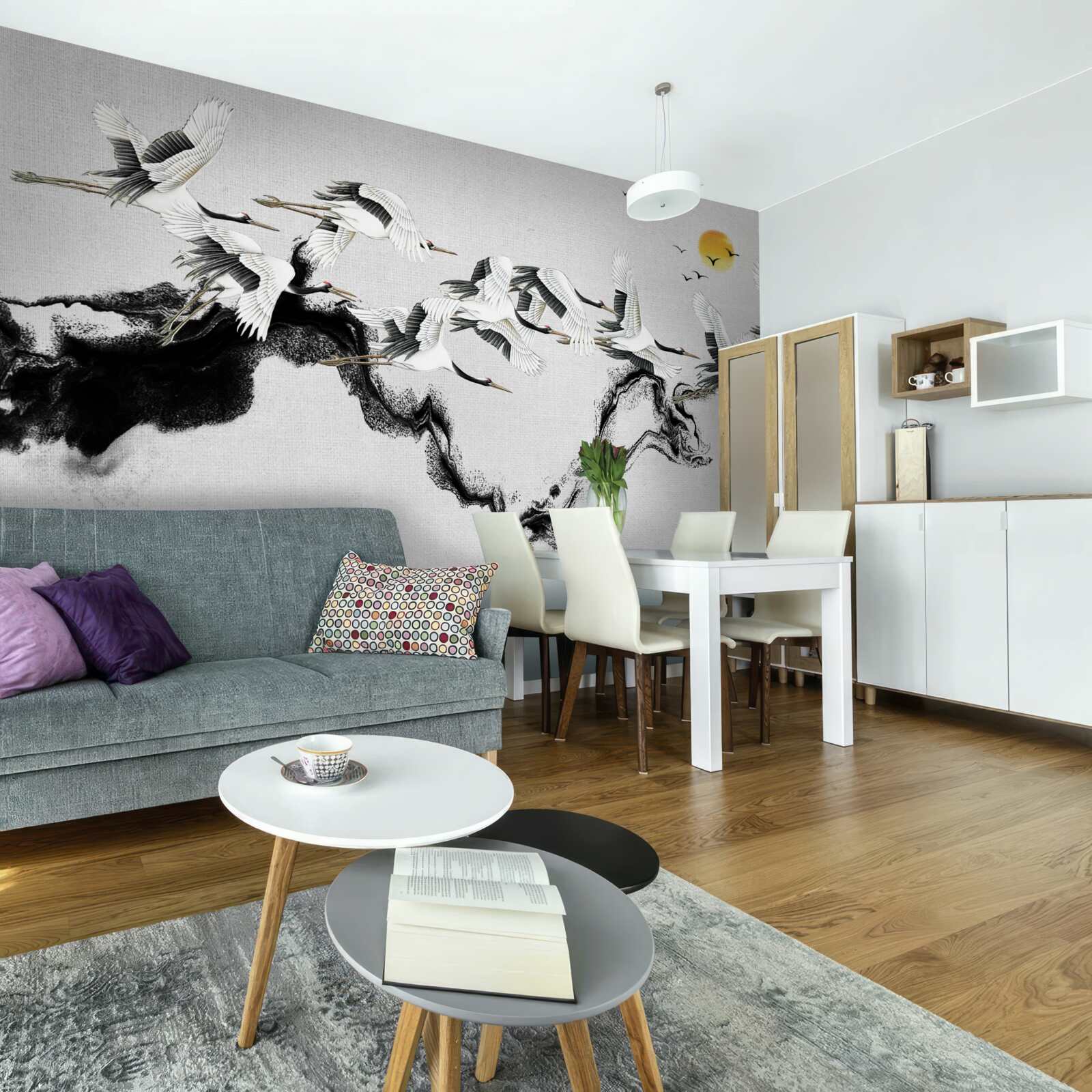 Fototapeta Skupina žeriavov z Japonska stúpa k západu slnka