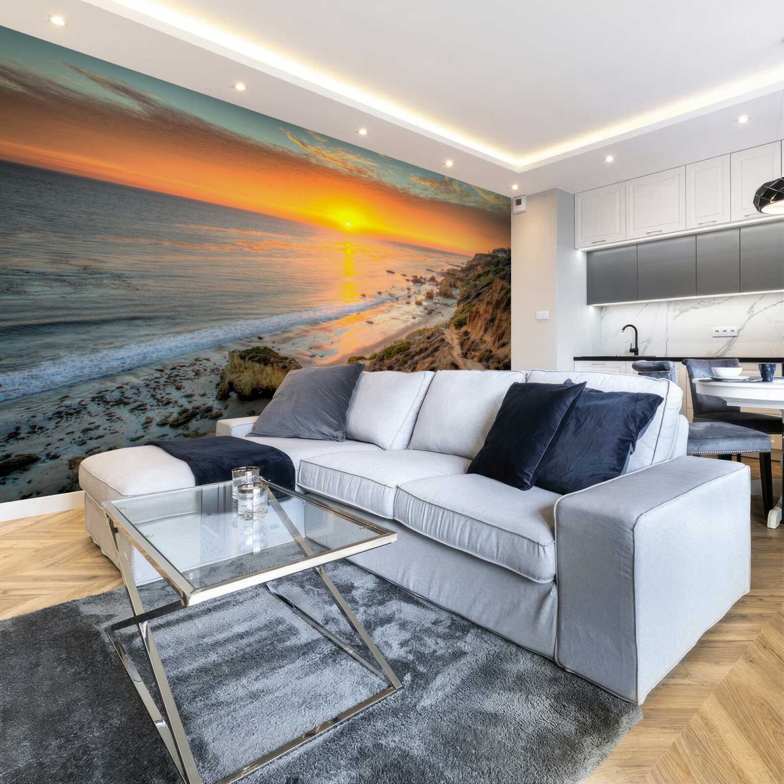 Fototapeta slnko klesajúce do oceánu pri západe slnka