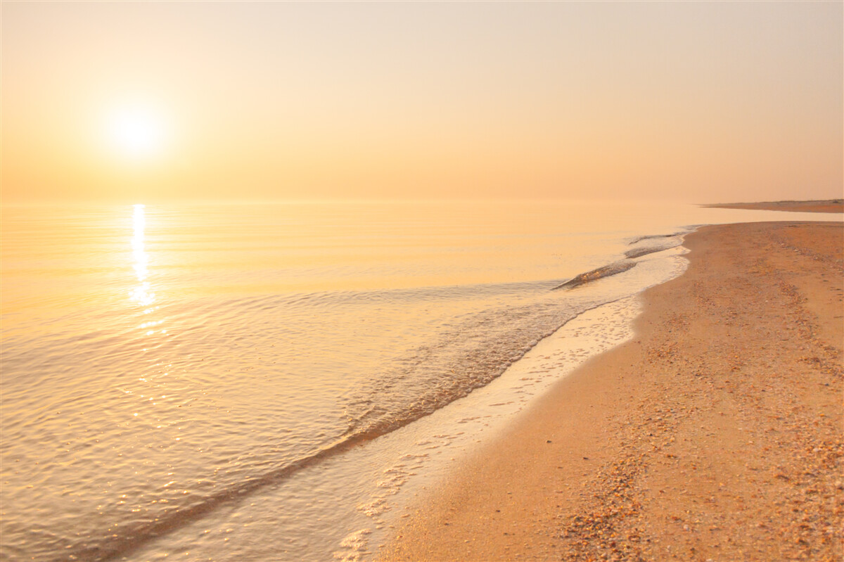 Fototapeta západ slnka nad morom v lete