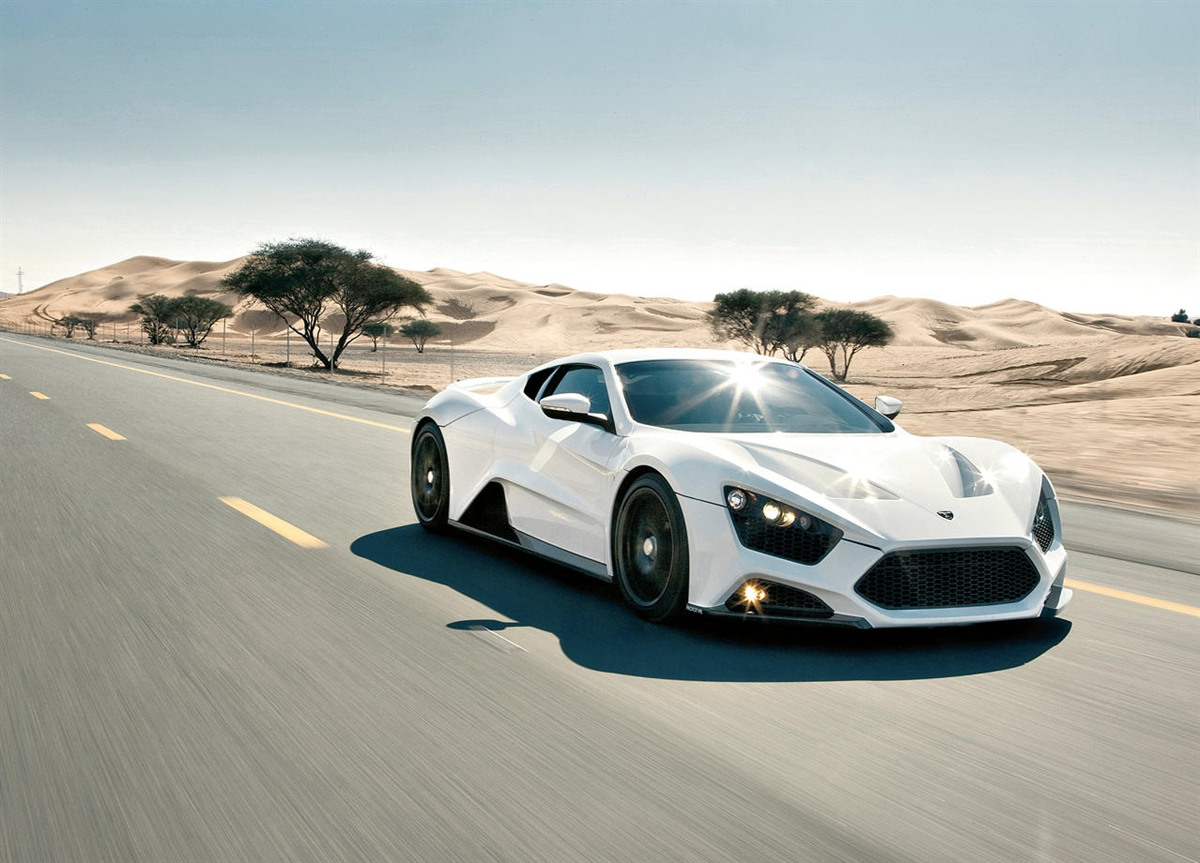 Fototapeta Biele športové auto jazdiace na ceste