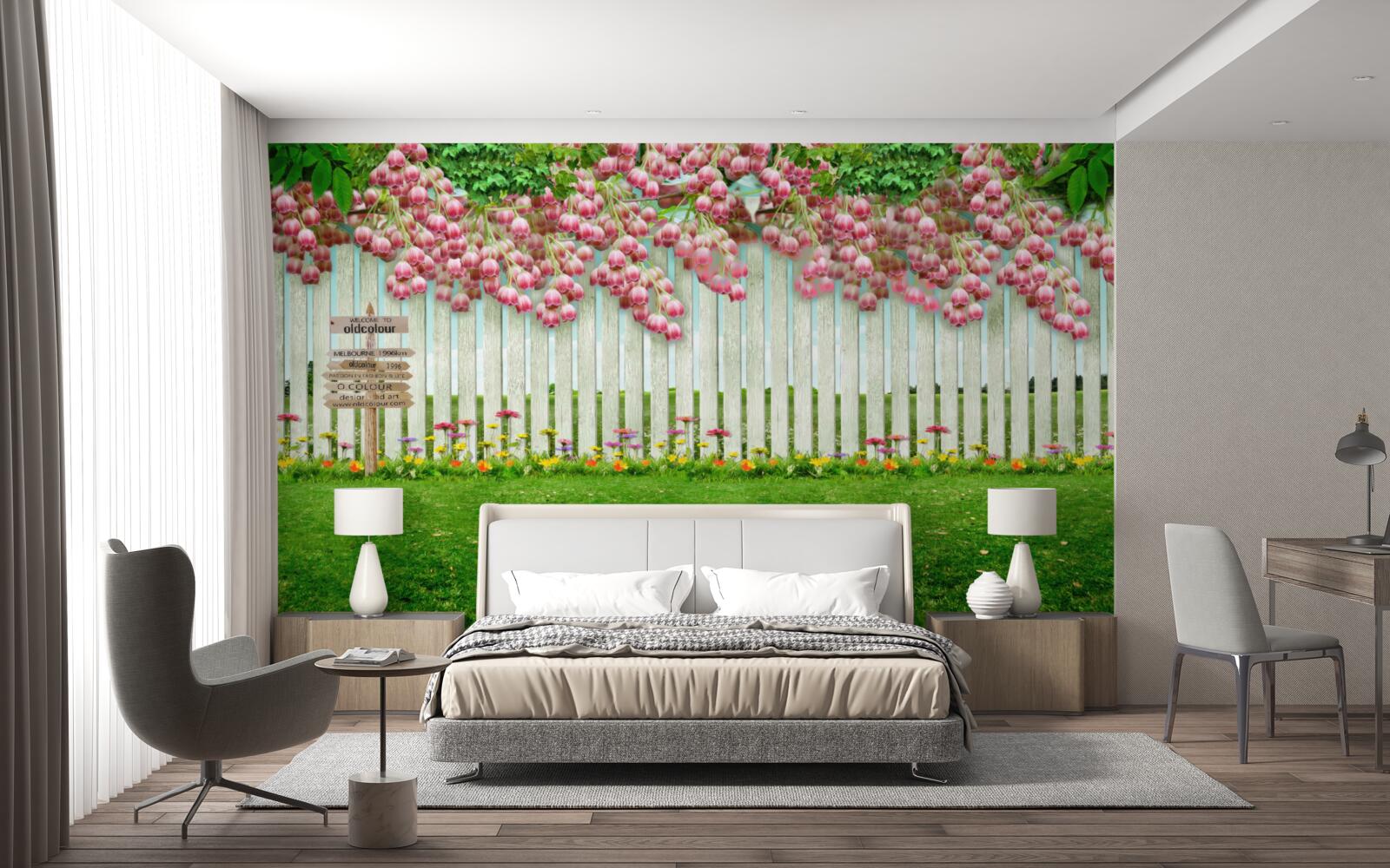 Fototapeta ružové kvety kaskáda cez biely plot