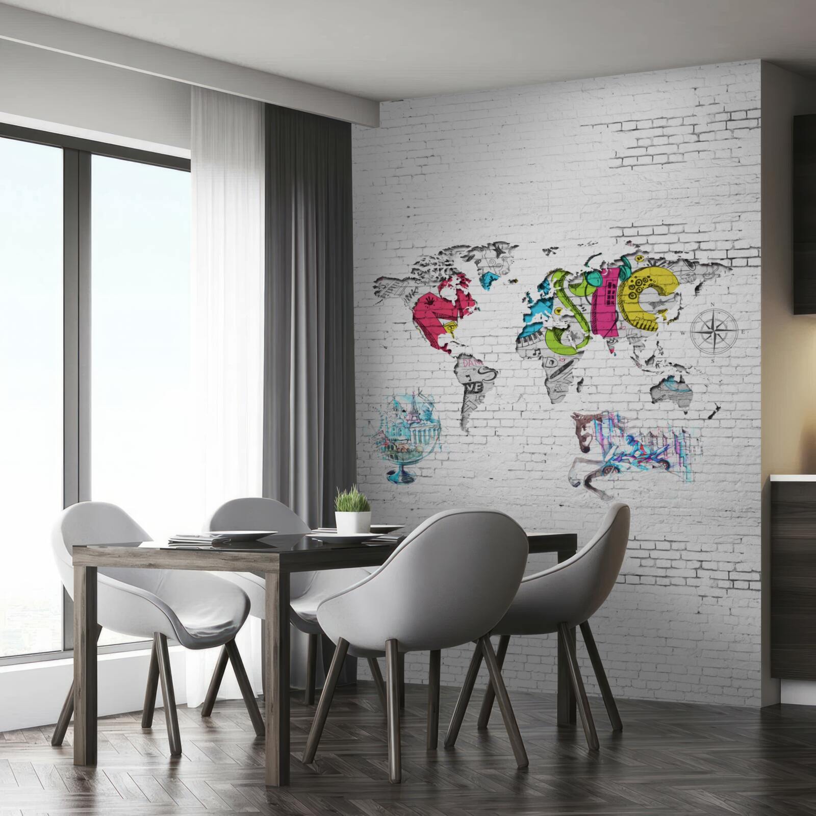 Fototapeta mapa sveta v rôznych farbách na bielej tehlovej stene