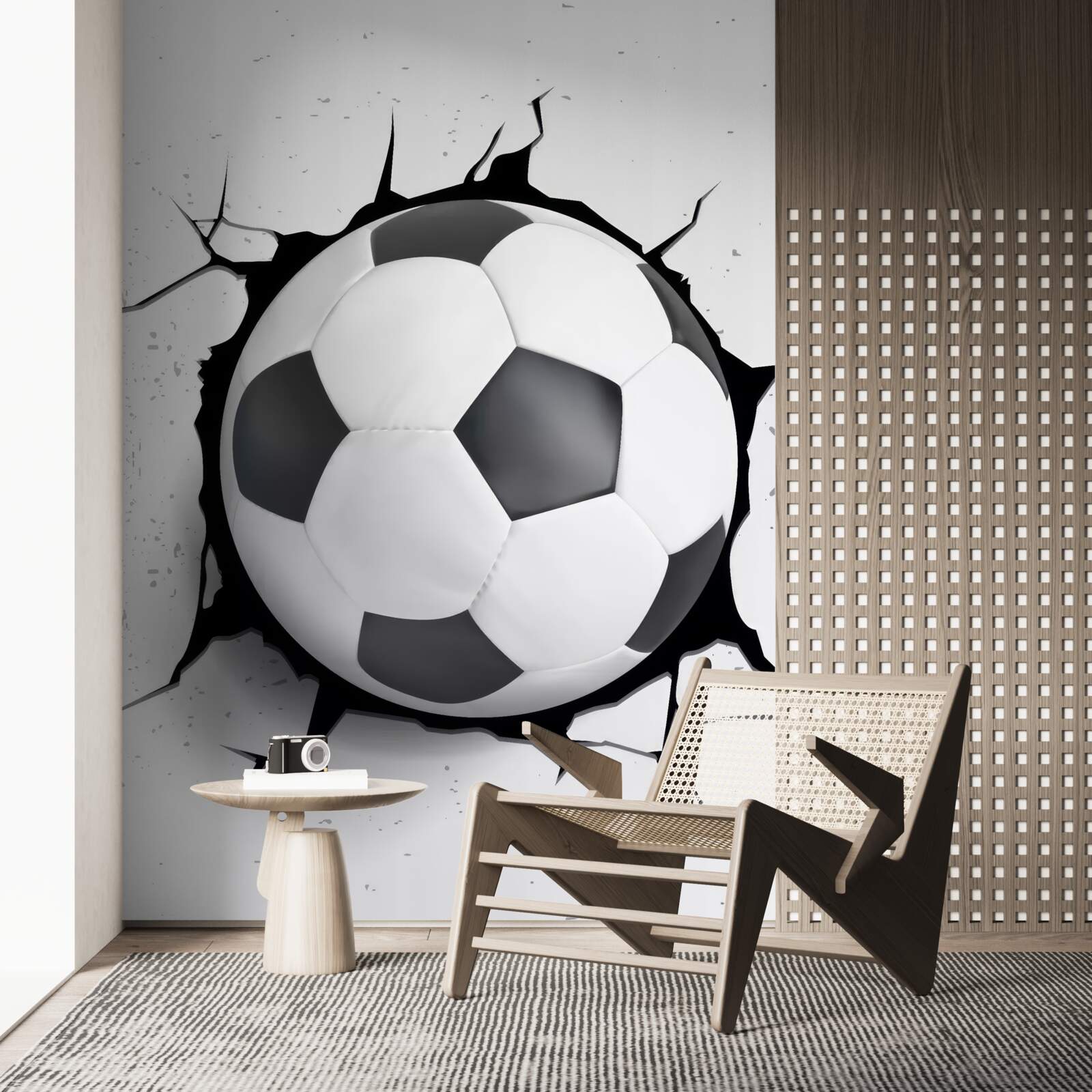 Fototapeta zo steny trčí futbalová lopta