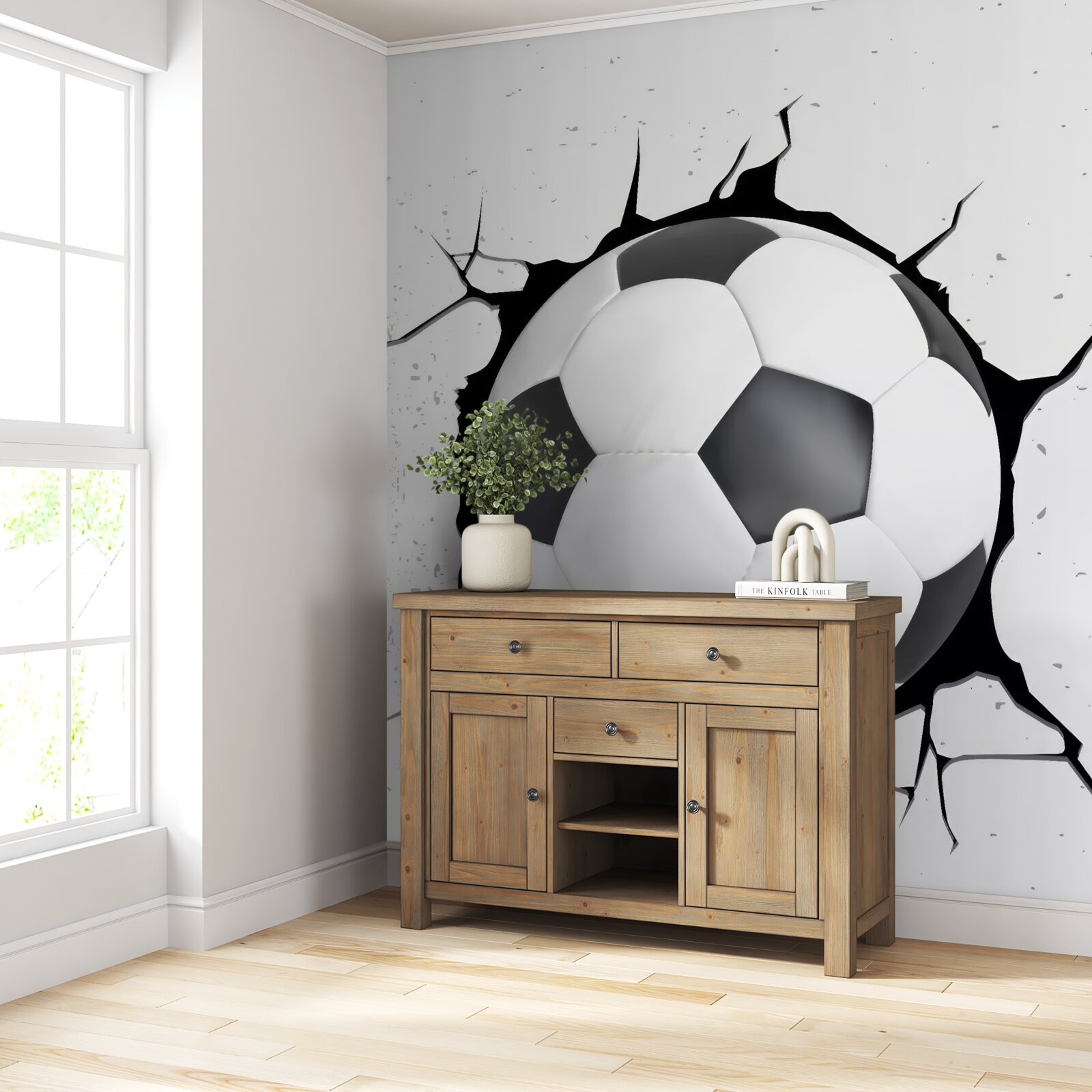 Fototapeta zo steny trčí futbalová lopta