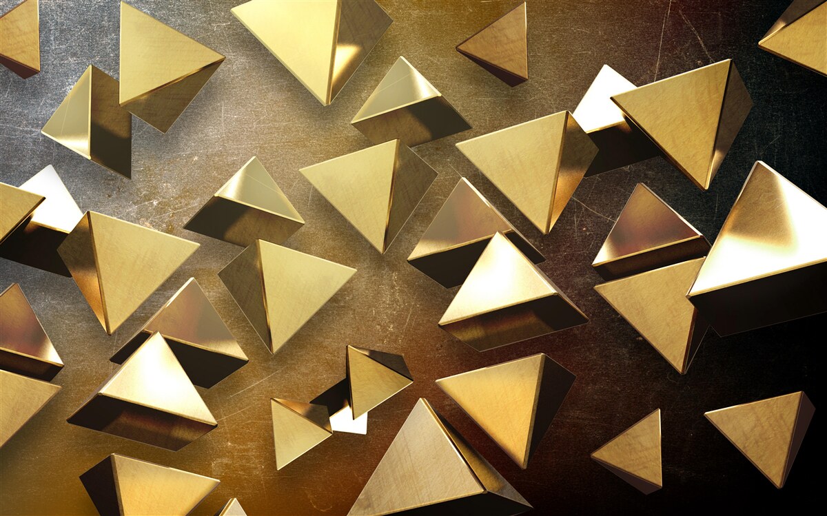 Fototapeta malé, objemné zlaté trojuholníky